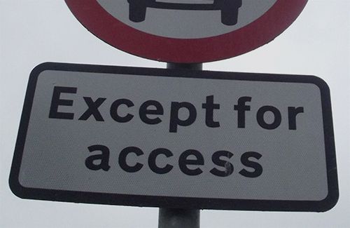 Part of a road sign that reads, 'Except for access'.