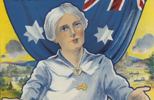 A colour poster featuring a Caucasian, older woman with white hear, a white blouse and brown skirt. Her arms are outstretched like she is offering the viewer a hug. The woman is standing in front of a hanging Australian flag. Behind the woman and the flag is a rural landscape. Above the woman, and over the flag is the words, 'Women! help Australia's sons win the war', and below the woman in front of her skirt is the words 'Buy war loan bonds'.