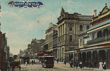 A postcard featuring a coloured black and white photo of Queen Street, Brisbane, circa 1908. It includes a number of historic buildings, including the post office with a large clock in view.
