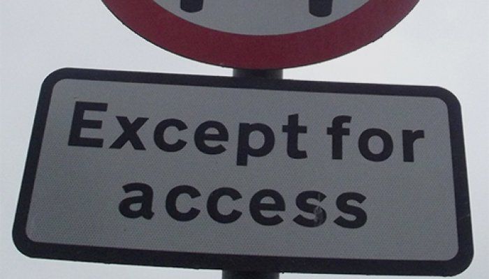 Part of a road sign that reads, 'Except for access'.